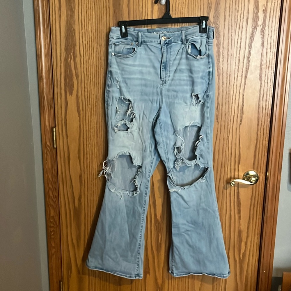 ripped blue flare jeans